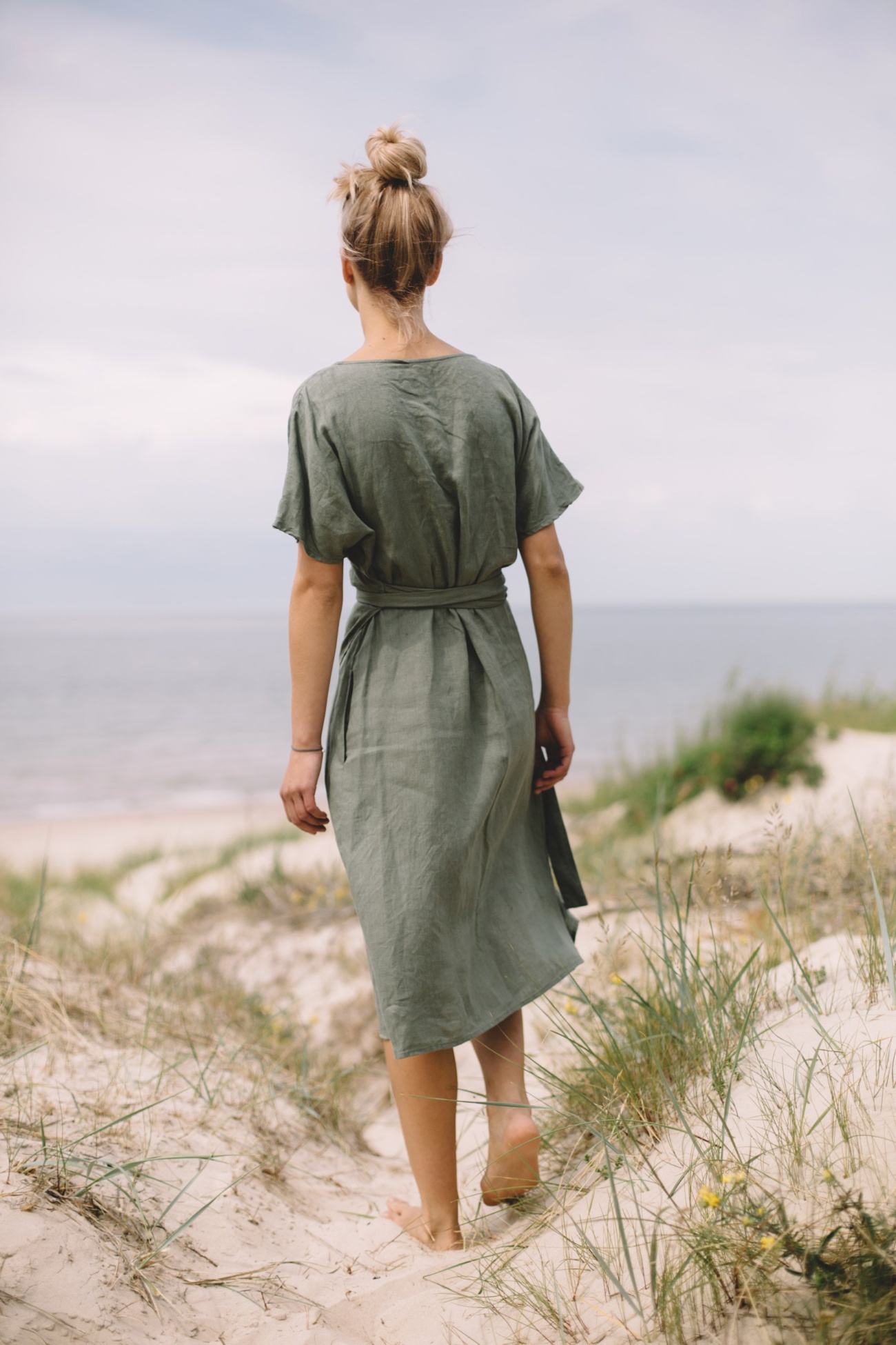 the back of green linen wrap dress