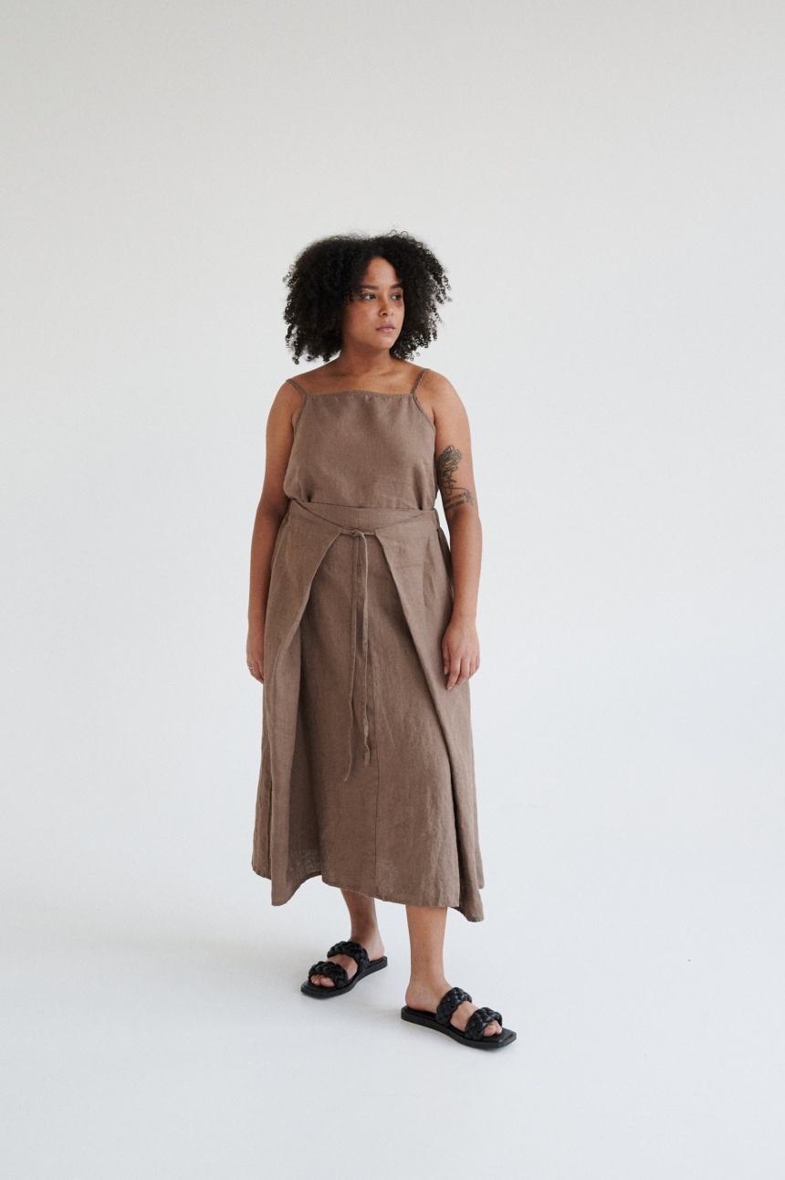 women is wearing brown linen midi skirt