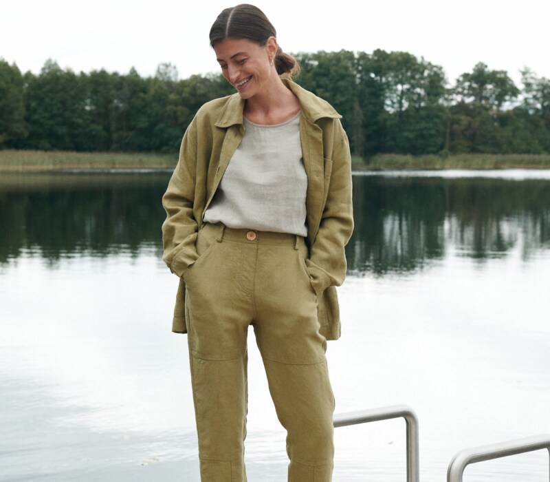 Heavy linen utility jacket and trousers outfit with a tucked in linen shirt