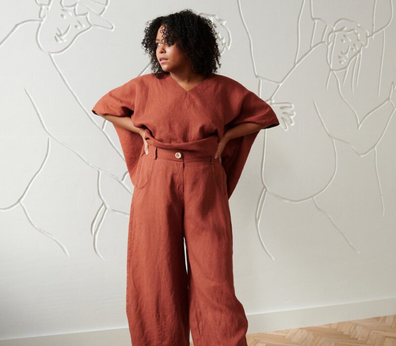 A model in brown linen wide leg trousers