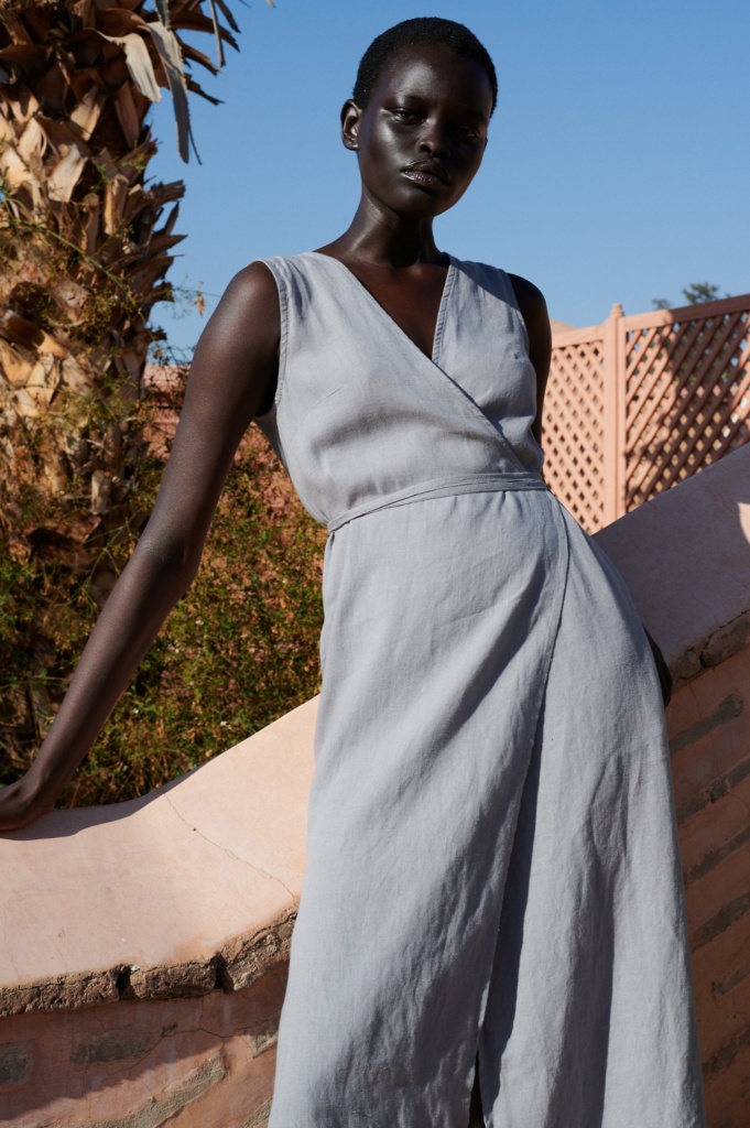 model wearing a linen wrap midi dress