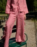 Red gingham wide leg pants with side ties and adjustable slit detail