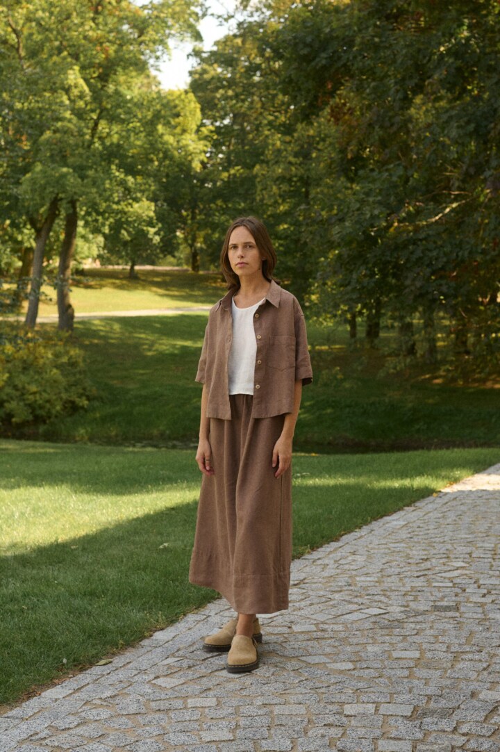 model is wearing brown linen skirt