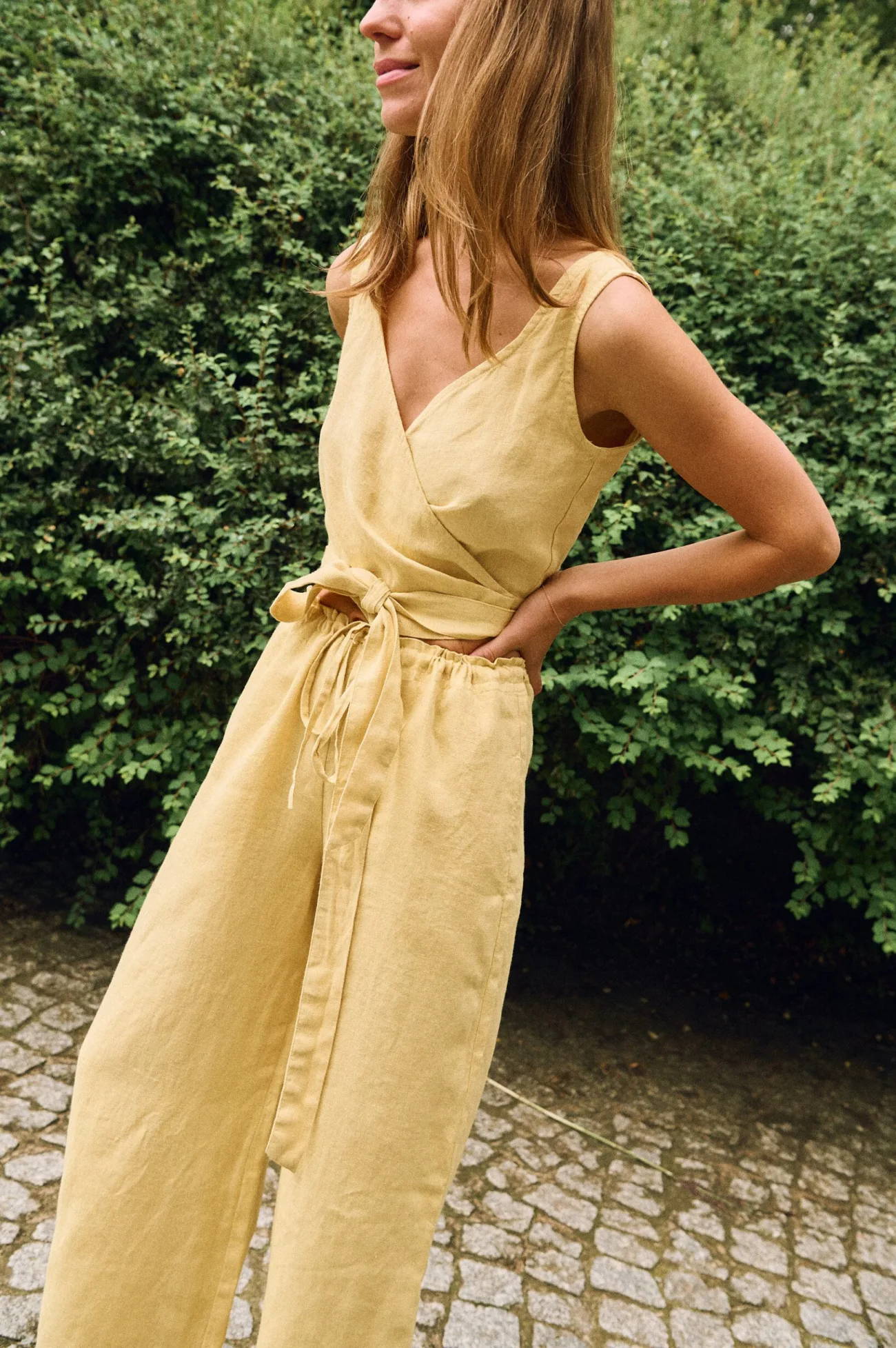 Butter yellow linen wrap top and wide-leg trousers made from breathable natural linen