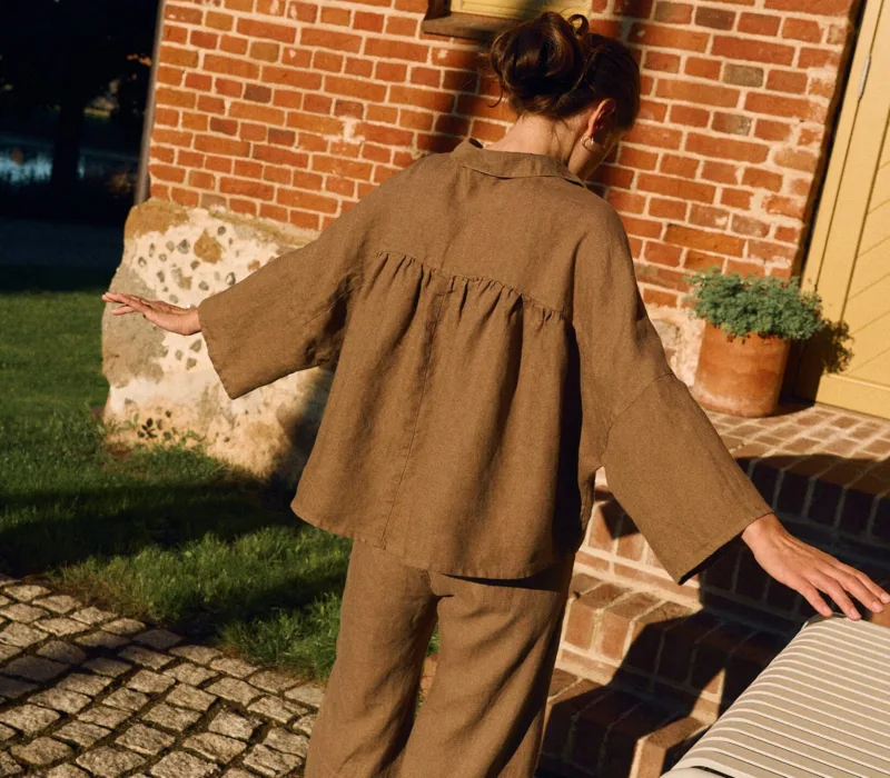Cacao linen shirt with ruffled gathered back and relaxed oversized fit, back view