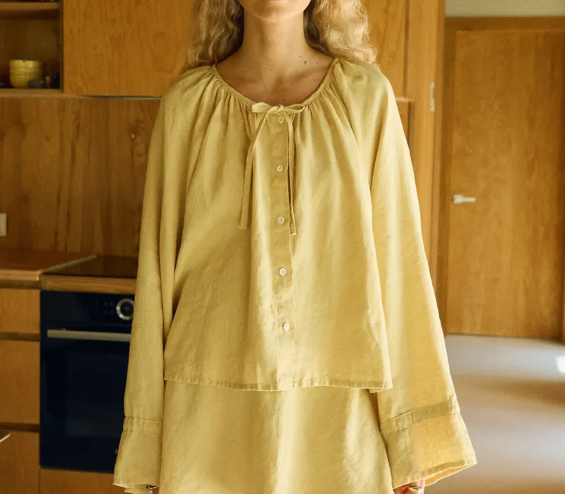 Butter linen two-piece outfit with balloon sleeve blouse and flared mini skirt