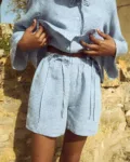 Blue mini gingham linen shorts with relaxed fit and softly gathered elastic waist
