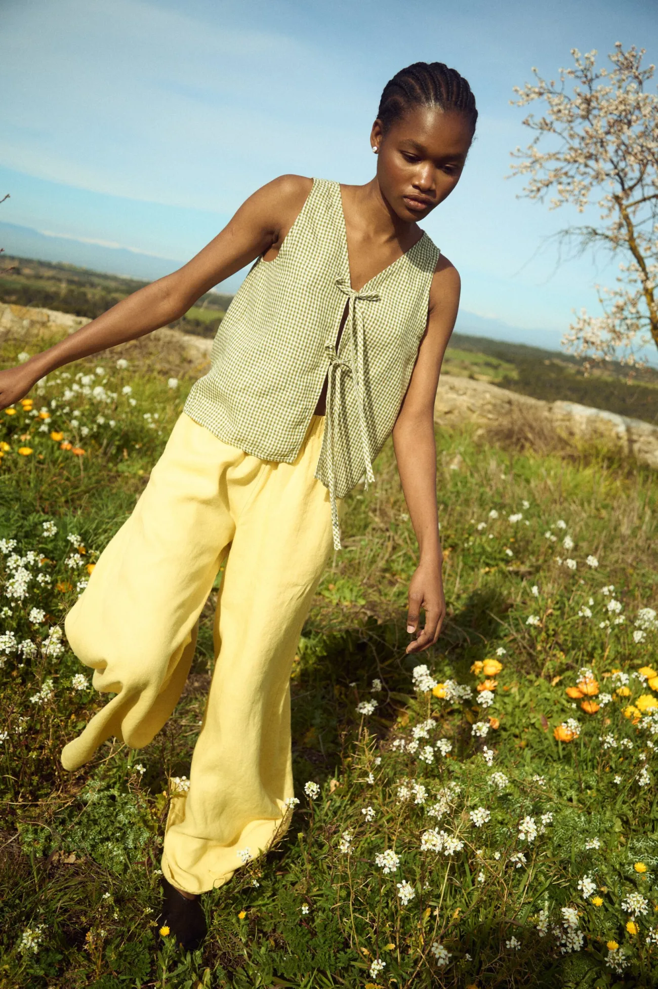 close-up of gingham tie front top and butter linen culottes