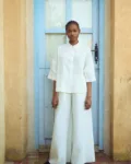 Wide leg white linen culottes worn with matching linen shirt