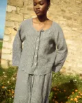 Black gingham linen top with tie neckline and relaxed fit, paired with a matching skirt