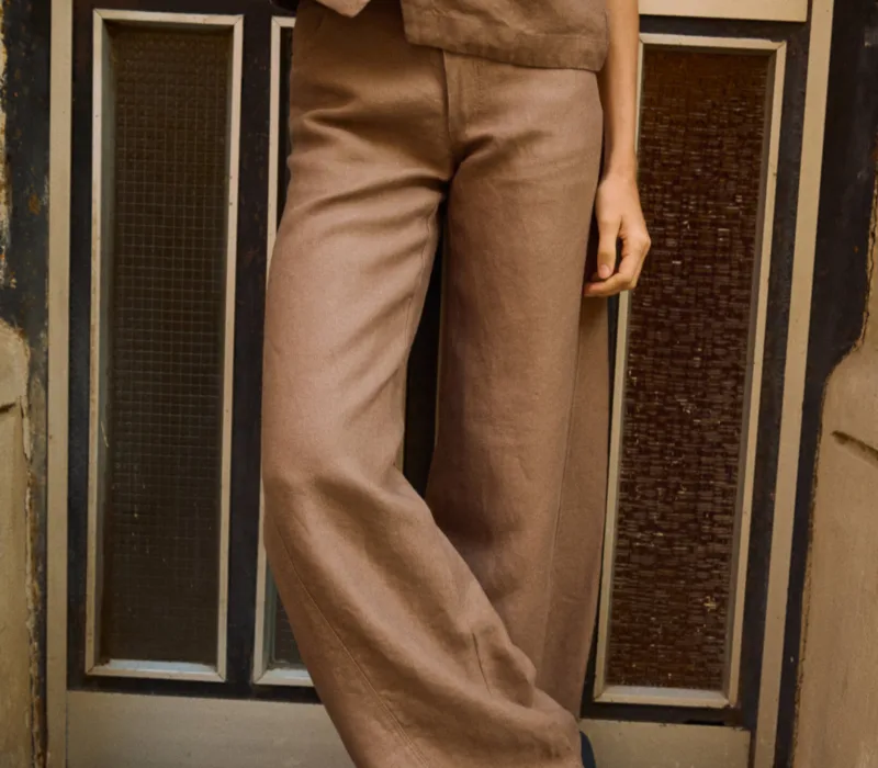 Brown heavy linen wide-leg trousers styled with a matching button-front linen vest