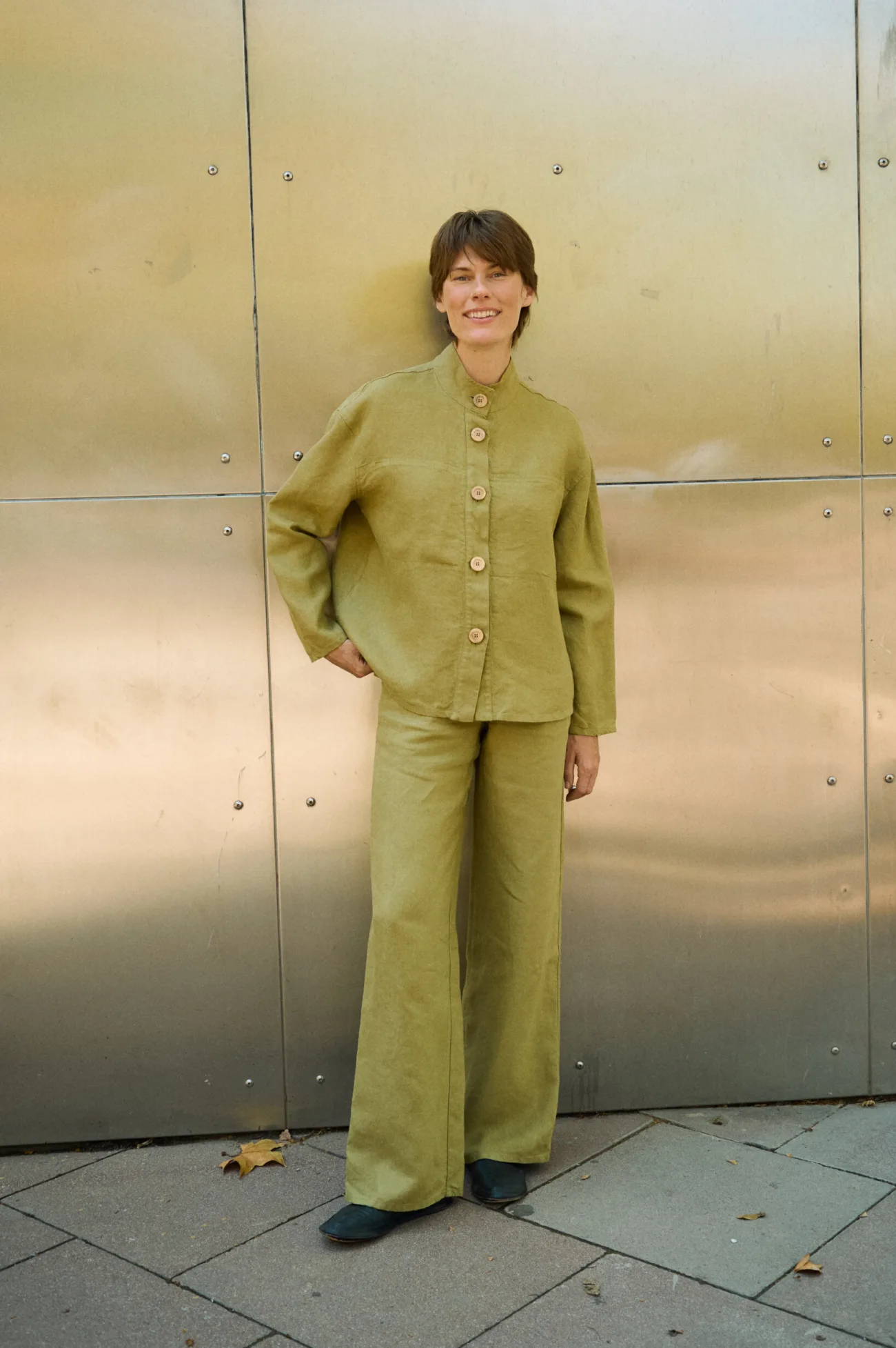 Olive heavy linen wide-leg trousers styled with a matching linen button-up jacket