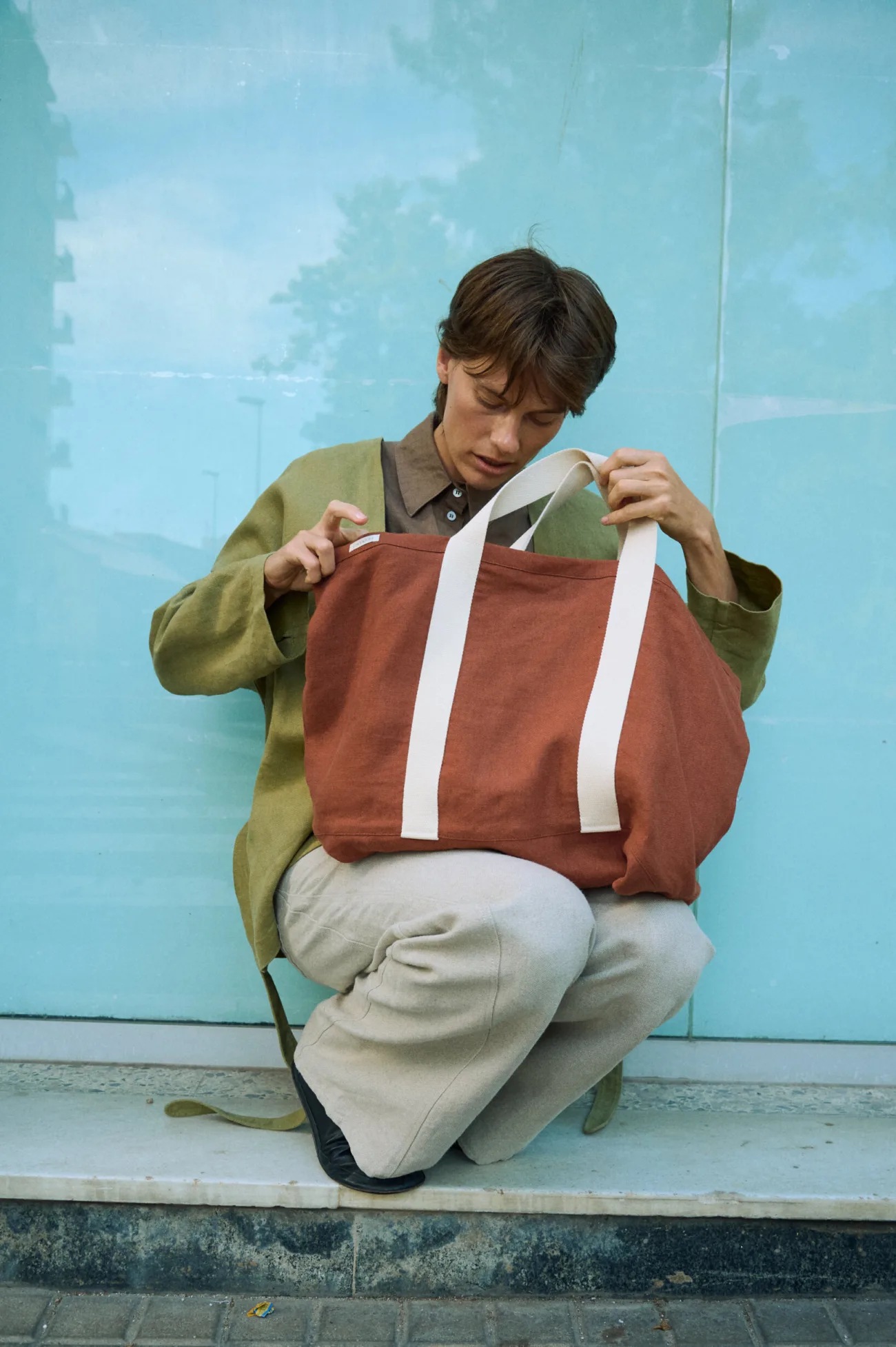 Terracotta heavy linen tote bag with wide cotton handles and a roomy structured shape