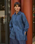 Blue striped linen button-up shirt with a relaxed oversized fit, pointed collar and side slits