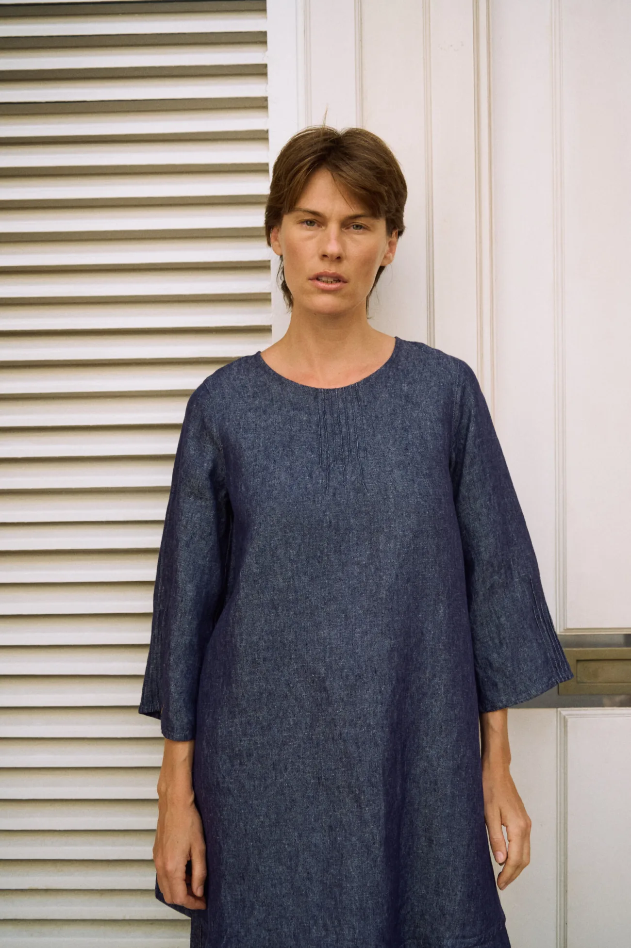 Denim linen tunic dress with a round neckline, delicate pintuck front detail and relaxed three-quarter sleeves