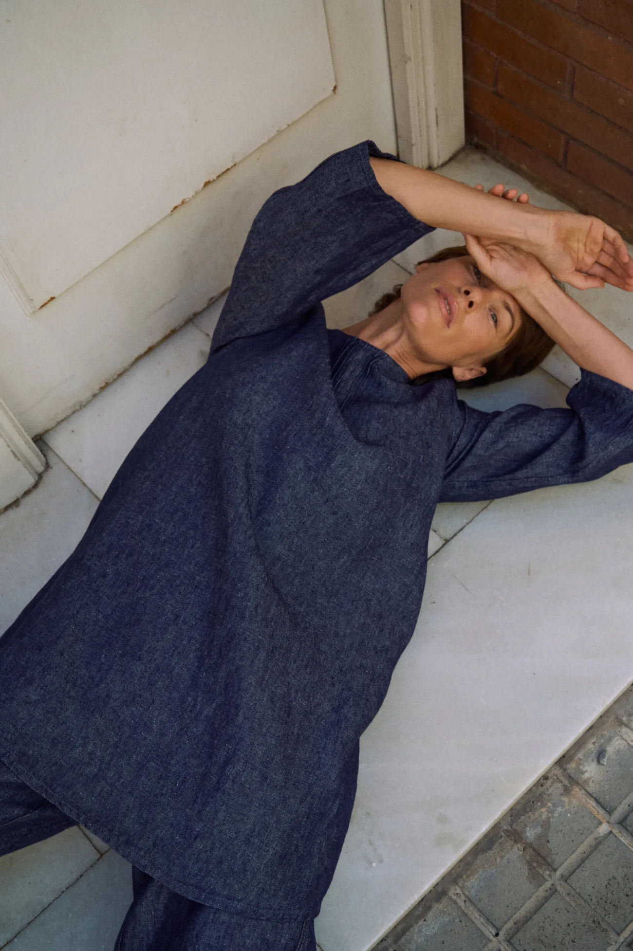 Denim linen tunic dress with three-quarter sleeves and subtle pintuck detailing at the round neckline